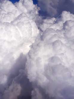 close-Clouds-view-through-airplane-window