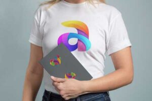 Mock-up-of-woman-t-shirt-holding-a-book-with-logo