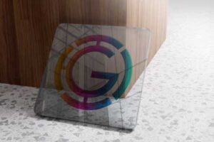 gold-logo-mock-up-glass-wooden-background