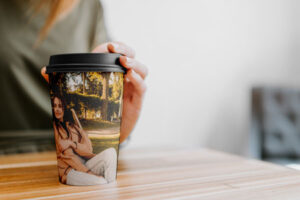 coffee-cup-with-hand-on-table-mock-up