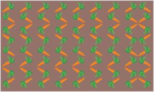 Carrot placed in stylish way on abstract brown background