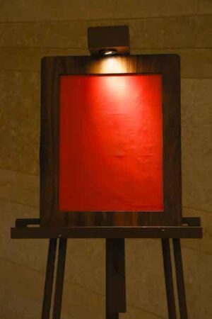 Surface light falling on red screen of standing board