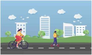 Girl cycling and boy stand on roller in midst of road near residence colony